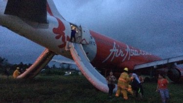 Jet Damazo-Santos tweeted this photo of passengers leaving the plane via emergency slides.