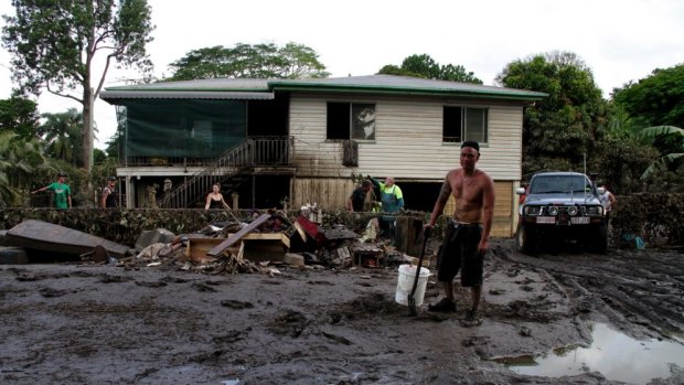 Paulo Balbarais begins cleaning his Goodna home after the 2010/11 flood.