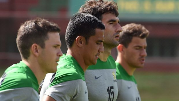 Socceroos Matt McKay, Tim Cahill, Mile Jedinak and James Troisi jog during training in Vitoria.