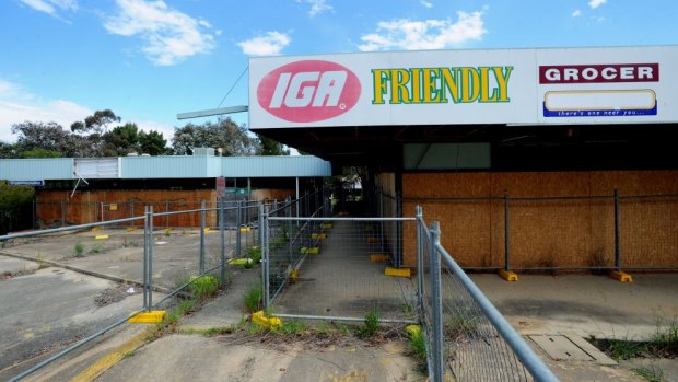 Uncertainty around the redevelopment of the derelict Giralang shops will continue for months.