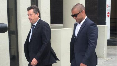 Former Eagle Daniel Kerr (right) arrives at the Perth Magistrates Court.