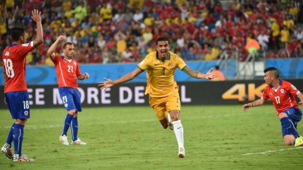 Tim Cahill celebrates playing a part in the 2014 World Cup goalfest during Australia's opening Group B match against Chile.     