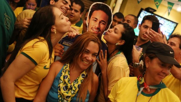 Home favourite: Neymar has become the face of the tournament.