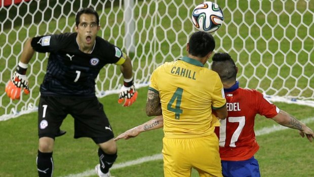 Tim Cahill heads home against Chile.