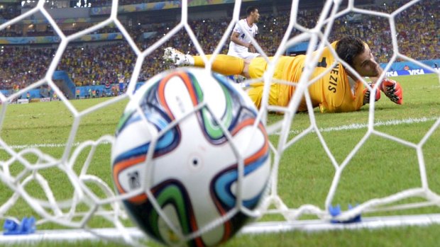The winning penalty: Greece's goalkeeper Orestis Karnezis looks round after Costa Rica's defender Michael Umana scored 