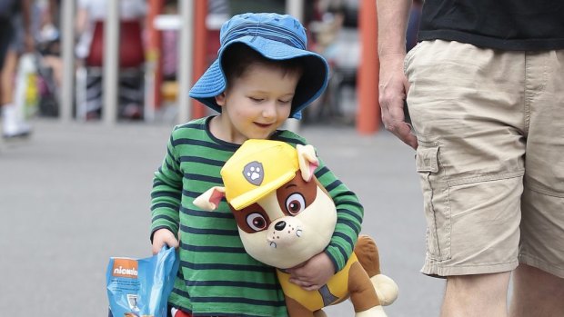 Wesley Kerr, 2, with his Paw Patrol showbag that included Rumble the dog. 