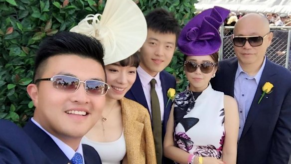 Andrews government adviser Mike Yang (left) with Tian Di (right) and Sisly Tian (second from right) at the Spring Racing Carnival in 2015.