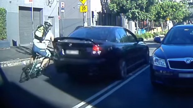 A frame grab from a video of the collision between Ray Kan's bike and a car on Bridge Road, Glebe. 