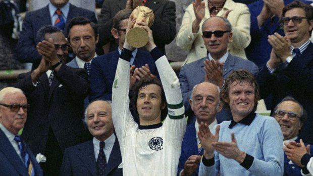 Under scrutiny ... West Germany captain, Franz Beckenbauer, holds up the World Cup trophy after his team defeated the Netherlands by 2-1, in the World Cup soccer final in West Germany on July 7, 1974.