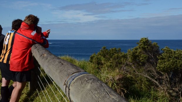 People watch the rescue operation.