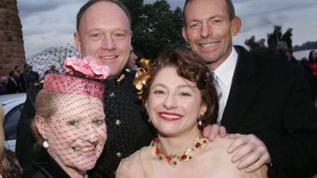 Bronwyn Bishop at the wedding of Sophie Mirabella, with Prime Minister Tony Abbott and another wedding guest, in 2006. 