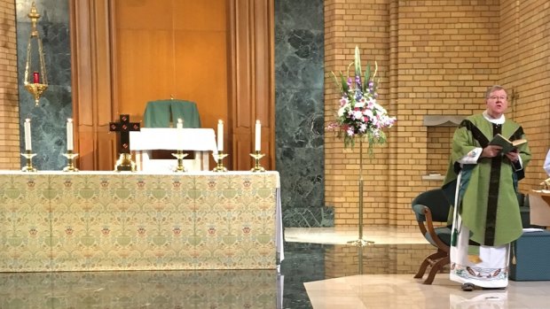 Father John Walshe conducting mass in October 2016 after he returned from Ireland.