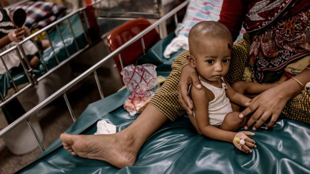 An infant cholera patient with his mother in the general hospital ward at the ICDDR,B.