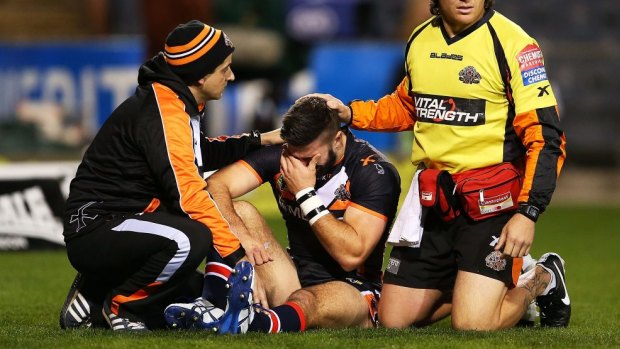 James Tedesco is consoled by trainers after suffering his injury.