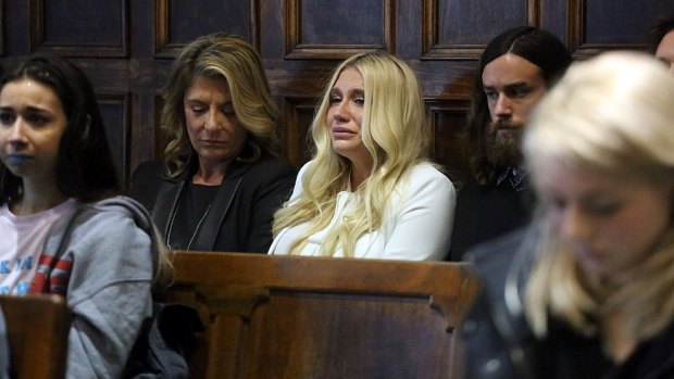 Singer Kesha cries as she learns she will not be released from her record label contract in Manhattan Supreme Court on Friday.