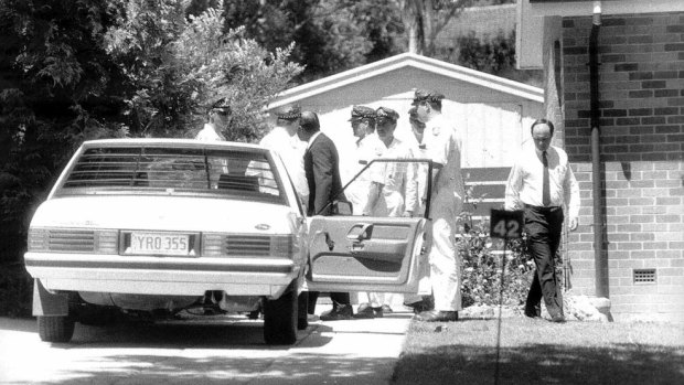 Detective
Sergeant Bob Lehman and police with the car in which Assistant Commissioner
Colin Winchester was shot in his neighbourâs driveway â 1989. 
