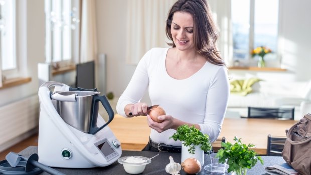 A newer model of the Thermomix has locking mechanisms on each side of the lid to hold it down in place.