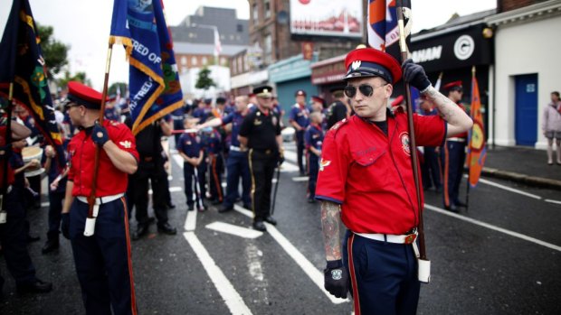 Loyalist bandsmen prepare to march in north Belfast.