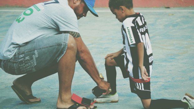 "After the Cup has finished, the problems still remain. It will still be a four-hour wait in emergency": Carlao, ex-Flamengo player and favela father figure.