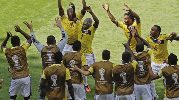 Colombian players celebrate their first goal.