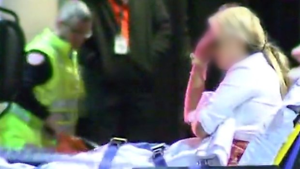 A woman attended to by paramedics near King Street nightclub Inflation.