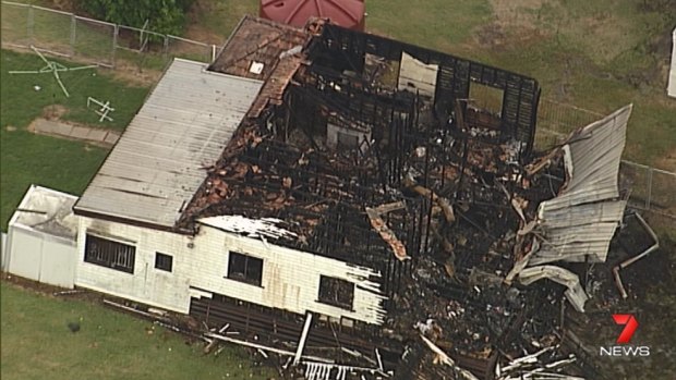A house fire in Ipswich has left a teenager severely burnt and 10 dogs dead