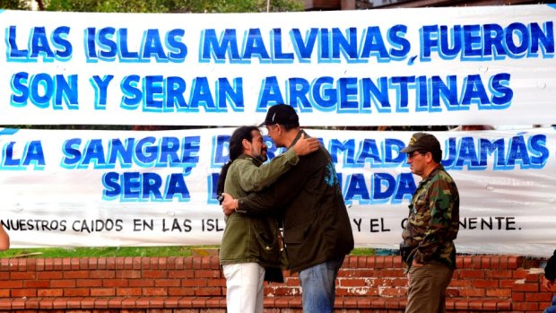 Veterans of the 1982 Falklands (Malvinas) War greet each other at Plaza de Mayo, Buenos Aires, before participating in a ceremony to honour the conflict's fallen soldiers.