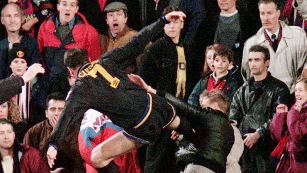 Moment of madness: Eric Cantona takes on a Crystal Palace fan. 