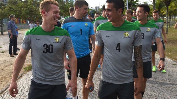 Oliver Bozanic and Tim Cahill take a stroll along the waterfront in Vitoria.