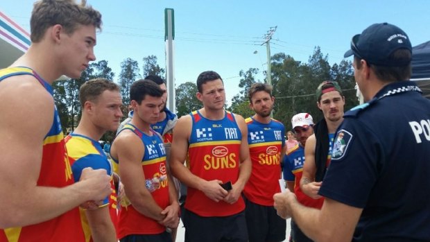 Gold Coast Suns players at a briefing for the search.