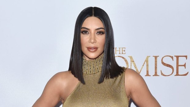 Warm up your ghd, Kim Kardashian is all about the pin straight hair these days.