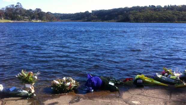 Bunches of flowers laid at Wentworth Falls Lake in the Blue Mountains by friends of Michael Ryall, who drowned while fishing in the lake  on Wednesday.