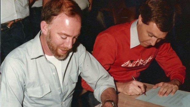 Lex Watson (left) and Robert French signing statutory declarations in 1983.