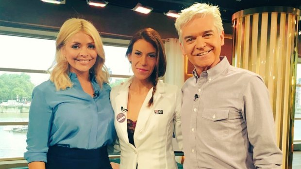 Marion Bartoli, centre, poses with hosts on a British breakfast television show.