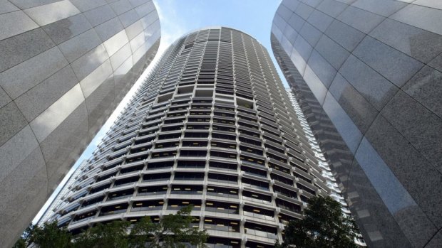The Grosvenor Place skyscraper towers over entrance columns and the complex's courtyard in central Sydney.