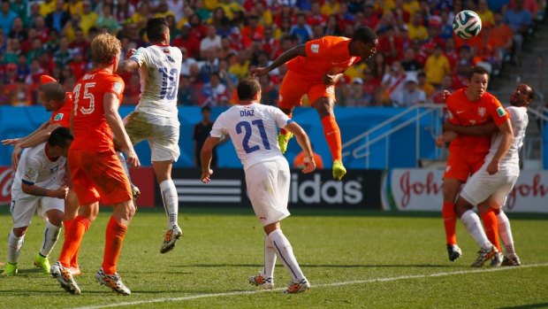 Substitute Leroy Fer heads home the opening goal for the Dutch.