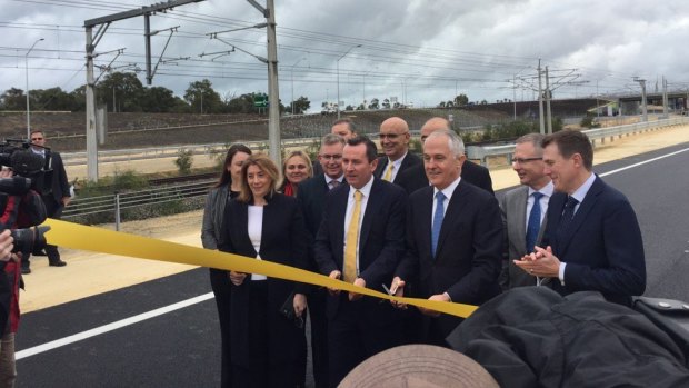 "It's my ribbon". 13 state and federal MP's get giddy about the opening of a road.