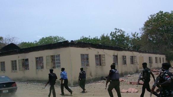 Security forces at the government school three days after gunmen abducted nearly 300 girls