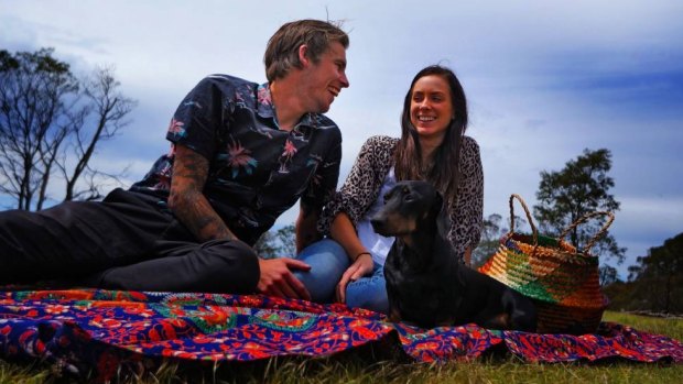 Scott and Hayley with their dog Archibald in 2014.