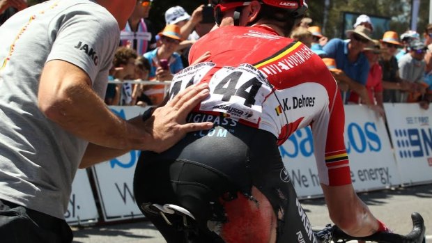 Ouch: Blood drips off Kenny De Haes after Friday's mass crash.
