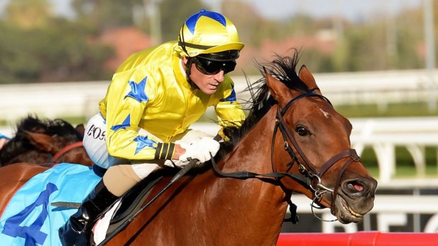 Glen Boss rides Midsummer Sun to victory at Caulfield in 2013. 