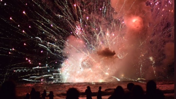 Crowds have been evacuated from Terrigal Beach, after a barge carrying fireworks caught alight during their 9pm show.
