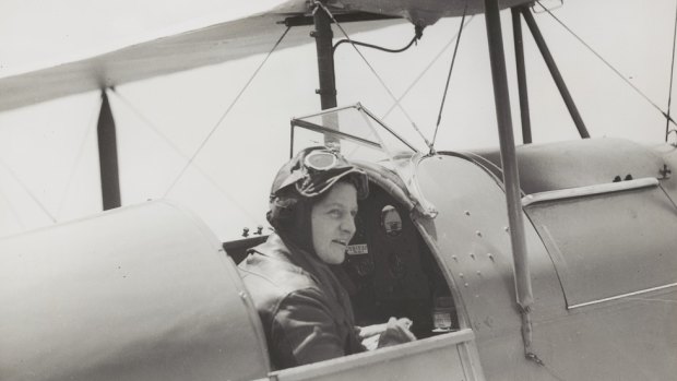 Freda Thompson sitting in the cockpit of a de Havilland DH.60G-III Moth Major.