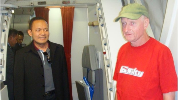 Peter Walbran, right, arrives in Indonesia in 2011 to face child rape charges.