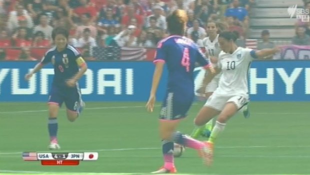 Carli Lloyd shoots from the half-way line and scores.