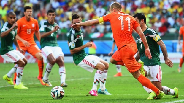 Fouled: Dutch striker Arjen Robben is tripped by Rafael Marquez of Mexico.