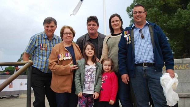 Peter Earnshaw (left) and his family paid their respects at the dawn service in Kings Park.