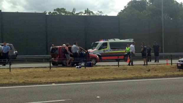Police and ambulance at the scene of a crash that ended a high speed chase just south of the border on the M1.