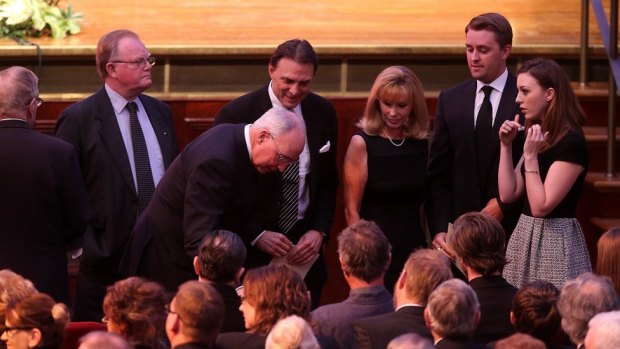 Former Australian Prime Minister Paul Keating talks to Wran family members at the State funeral of former NSW Premier Neville Wran at Sydney Town Hall. 