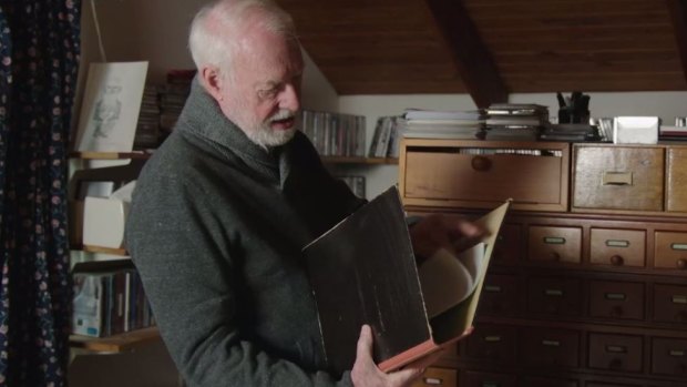 David Stratton in his home office, surrounded by his typed index cards. 